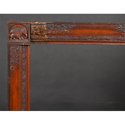 318 - 19th Century English School. An Indian Style Darkwood Frame, with animal motifs, rebate 34.5