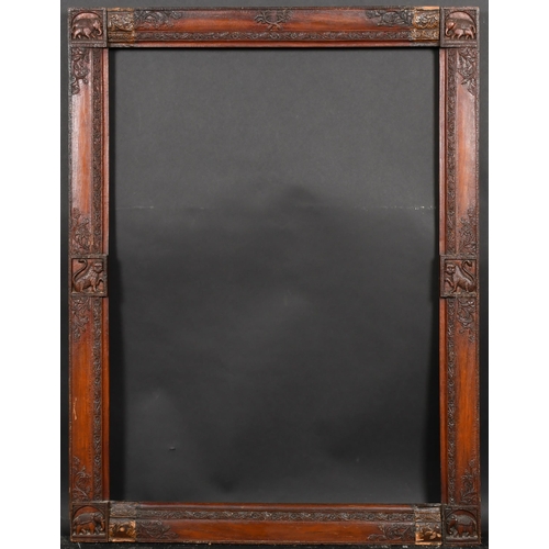 318 - 19th Century English School. An Indian Style Darkwood Frame, with animal motifs, rebate 34.5