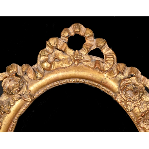 346 - 19th Century English School. A Gilt Composition Frame, with inset mirror glass, oval, rebate 26.5