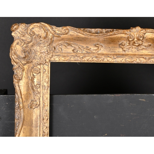 390 - 20th Century English School. A Gilt Composition Frame with swept centres and corners, rebate 19