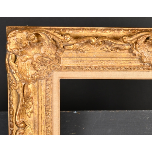 396 - 20th Century English School. A Gilt Composition Frame with swept and pierced centres and corners, re... 