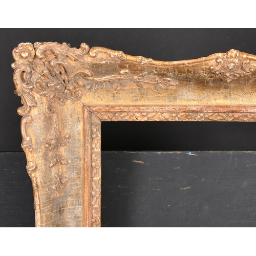 402 - 19th Century French School. A Gilt Composition Frame with swept centres and corners, rebate 17.5