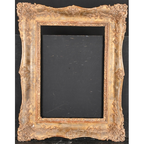 402 - 19th Century French School. A Gilt Composition Frame with swept centres and corners, rebate 17.5