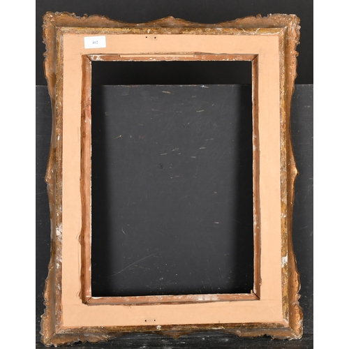 402 - 19th Century French School. A Gilt Composition Frame with swept centres and corners, rebate 17.5