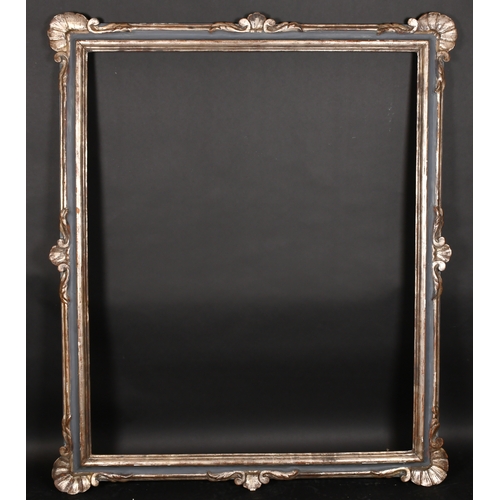 304 - Early 20th Century European School. A Silver and Painted Frame, with swept shell designs on centres ... 