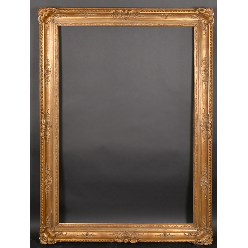 305 - Early 20th Century European School. A Gilt Composition Frame, with swept centres and corners, rebate... 