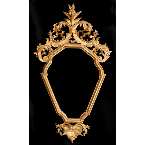 483 - 19th Century Italian School. An Ornate Mirror Shaped Frame, with inset mirror glass, rebate 23