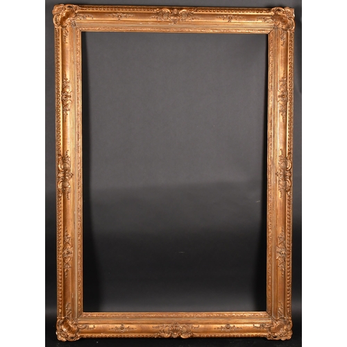 301 - Early 20th Century European School. A Gilt Composition Frame, with swept centres and corners, rebate... 