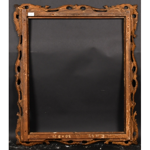 346 - 18th Century English School. A carved Giltwood Frame with swept and pierced centres and corners, reb... 