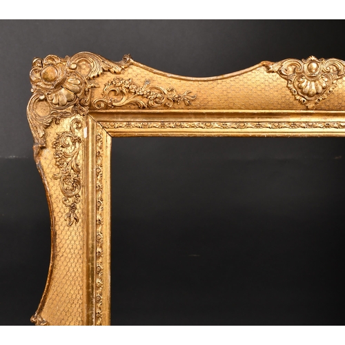 365 - 19th Century French School. A Gilt Composition Frame, with swept centres and corners, rebate 26