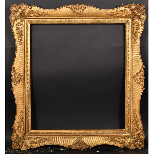 365 - 19th Century French School. A Gilt Composition Frame, with swept centres and corners, rebate 26