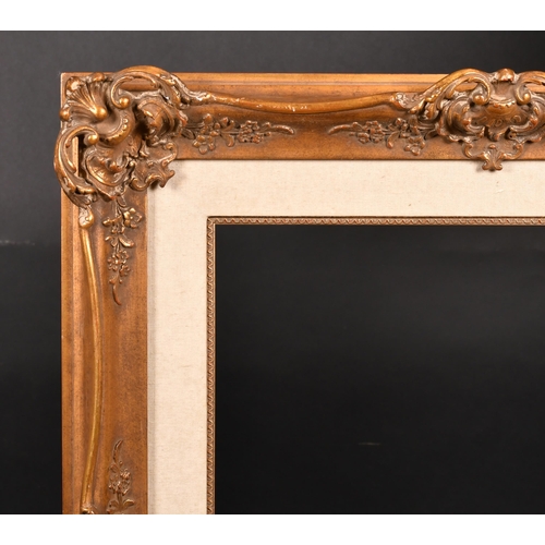 372 - 20th Century European School. A Gilt Composition Frame, with swept centres and corners and a fabric ... 