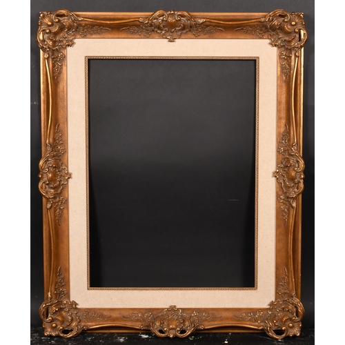 372 - 20th Century European School. A Gilt Composition Frame, with swept centres and corners and a fabric ... 