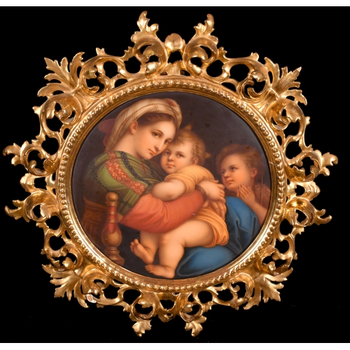 39 - After Raphael (1483-1520) Italian. 'Madonna della Sedia', Porcelain, In a fine carved giltwood Flore... 