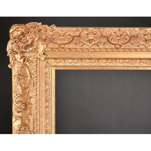 301 - 20th Century English School. A Gilt Composition Frame, with swept centres and corners, rebate 56