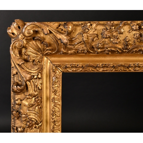 305 - Early 18th Century French School. A Fine Carved and Gilded Oak Regence Frame, with swept centres and... 