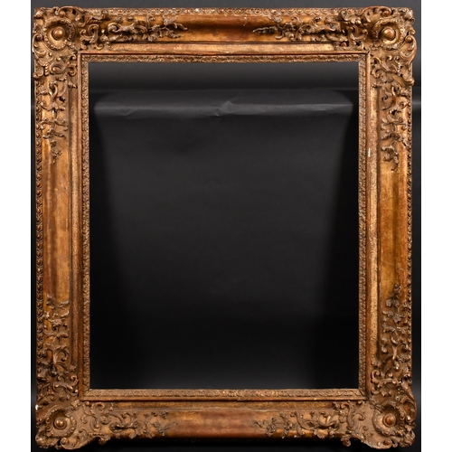 330 - 18th Century French School. A Carved Giltwood Frame, with swept corners, rebate 29.5