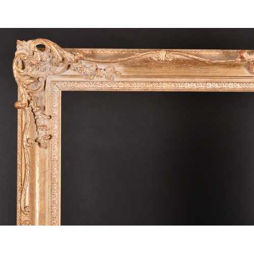 229 - 20th Century English School. A Gilt Composition Frame, with swept and pierced centres and corners, r... 