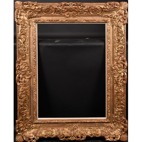 241 - 19th Century French School. A Gilt Composition Frame, with swept and pierced centres and corners, an... 