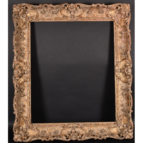 242 - 19th Century French School. A Carved Giltwood Frame, with swept centres and corners, rebate 30