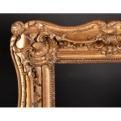 293 - 19th Century English School. A Carved Giltwood Frame, with swept centres and corners, rebate 21