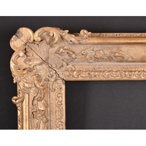 302 - Early 18th Century French School. A Louis XIV Carved Giltwood Frame, with swept corners, rebate 19