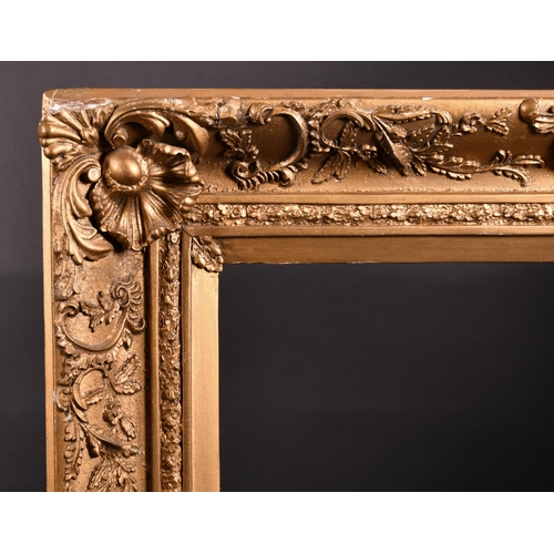 328 - 19th Century English School. A Gilt Composition Frame, with swept centres and corners, rebate 30