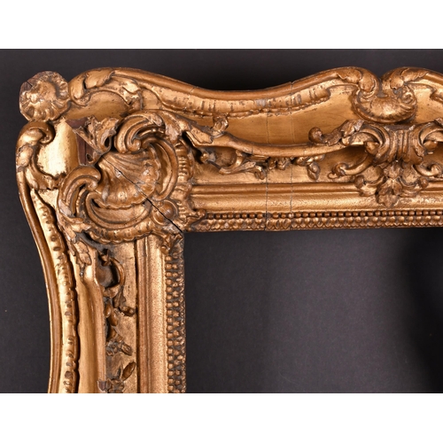 393 - 19th Century English School. A Carved Giltwood Frame, with swept centres and corners, rebate 21