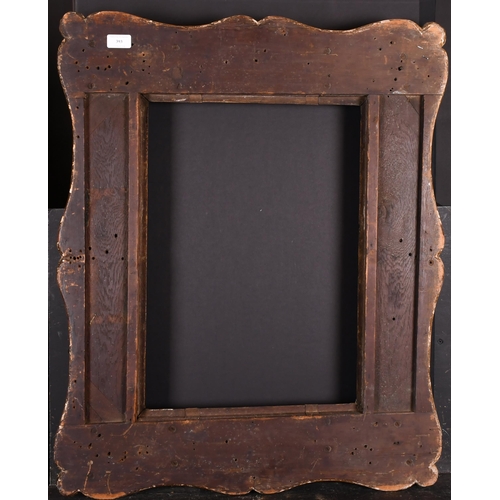 393 - 19th Century English School. A Carved Giltwood Frame, with swept centres and corners, rebate 21