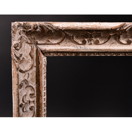 398 - 20th Century French School. A Painted Carved Wood Frame, with swept centres and corners, rebate 20