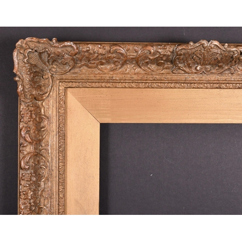 421 - 20th Century English School. A Gilt Composition Frame, with swept centres and corners and wooden sli... 