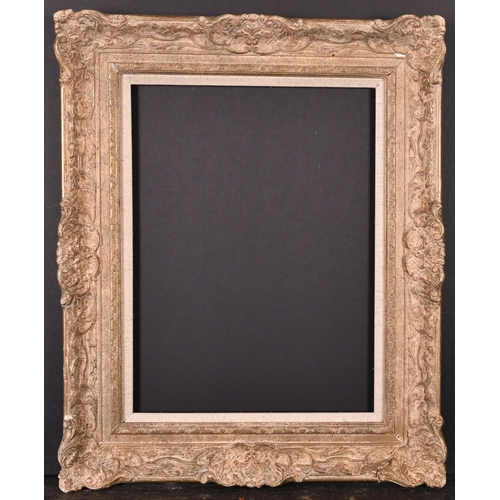 437 - 20th Century English School. A Gilt Composition Frame, with swept centres and corners and a fabric s... 