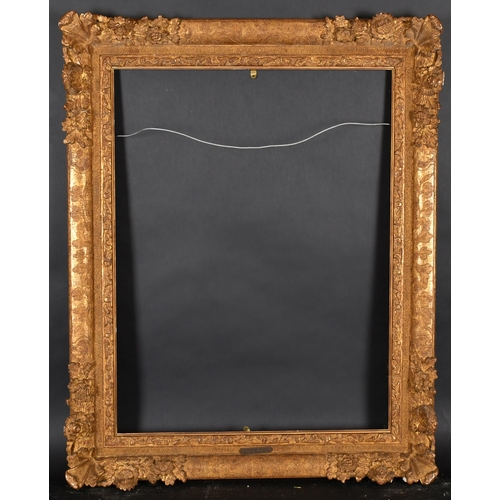 354 - 20th Century French School. A Gilt Composition Louis Style Frame, with swept corners, rebate 31