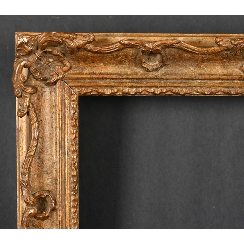 459 - 20th Century English School. A Gilt Composition Frame, with swept and pierced centres and corners, r... 