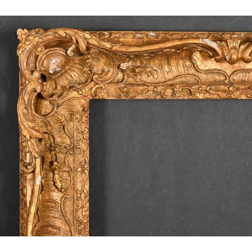464 - 18th Century French School. A Carved Giltwood Frame, with swept and pierced centres and corners, reb... 