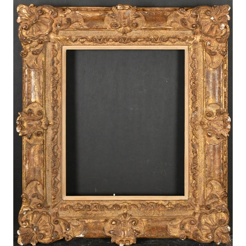 344 - 20th Century European School. A Carved Giltwood Frame, with swept centres and corners, and a fabric ... 