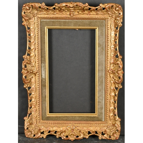 363 - 20th Century English School. A Gilt Composition Frame, with swept and pierced centres and corners, w... 