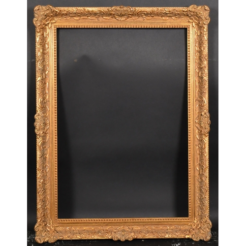 404 - 20th Century European School. A Gilt Composition Frame, with swept centres and corners, rebate 27