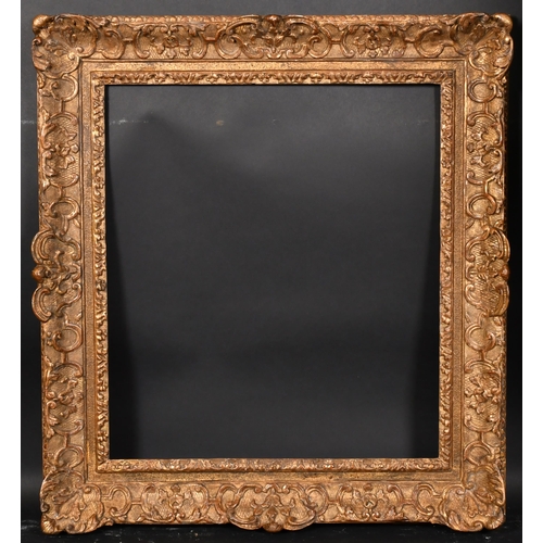 447 - 18th Century French School. A Carved Giltwood Regence Frame, with swept centres and corners, rebate ... 