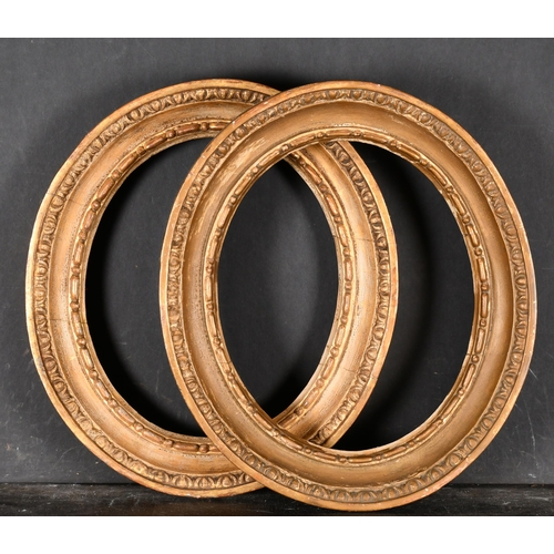 572 - 19th Century English School. A Pair of Oval Carved Giltwood Frames, rebate 11.25