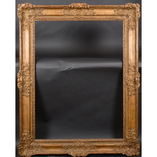 305 - 19th Century French School. A Louis Style Carved Giltwood Frame, with swept centres and corners, reb... 