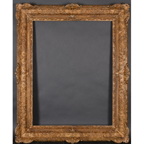 313 - 18th Century French School. A Louis X1V Carved Giltwood Frame with swept centres and corners, rebate... 