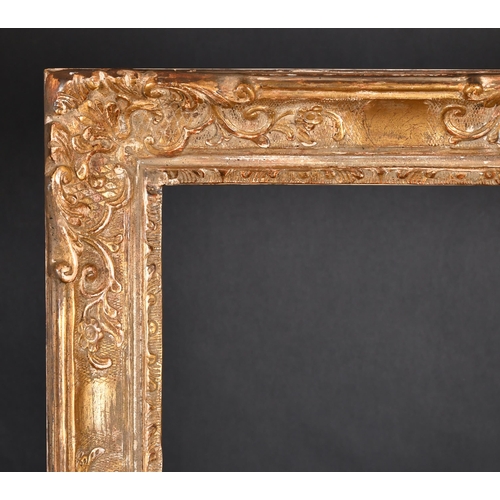 322 - 20th Century French School. A Louis Style Gilt Composition Frame with swept centres and corners, reb... 