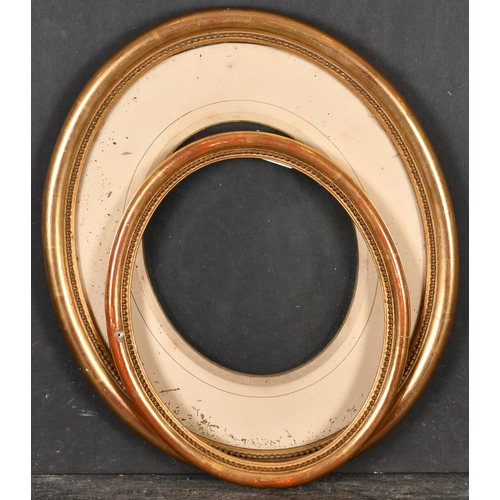 394 - 19th Century European School. A Gilt Composition Oval Frame, with inset glass and mount, rebate 14.2... 