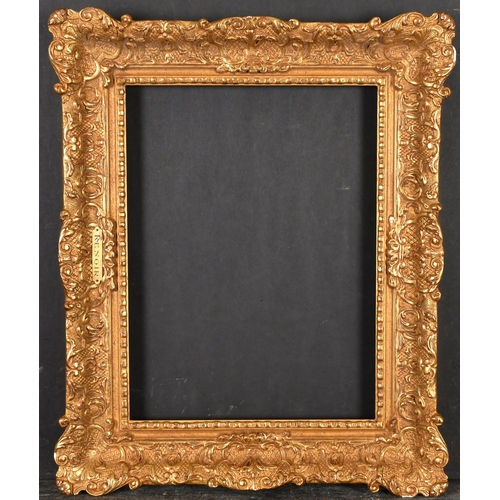 398 - 20th Century French School. A Gilt Composition Frame with swept centres and corners, rebate 14