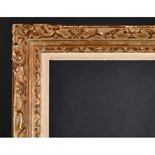 308 - 20th Century French School. A Carved Giltwood Frame, with swept centres and corners, and a white sli... 