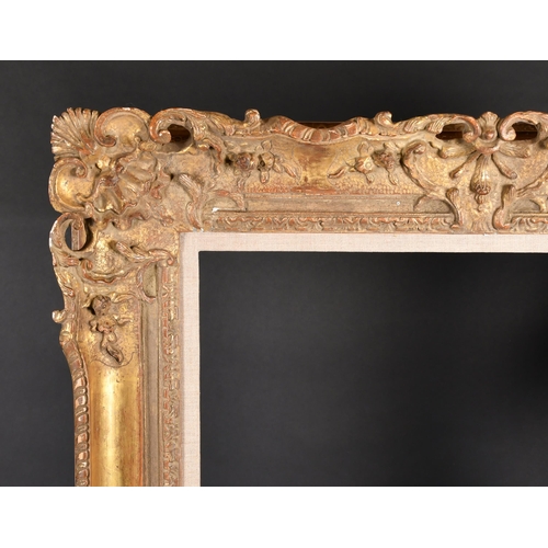 332 - 20th Century French School. A Louis Style Carved Giltwood Frame, with a fabric slip, rebate 44.25” x... 