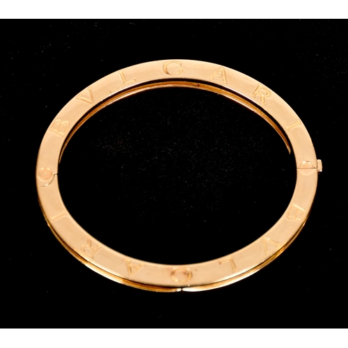 343 - Bulgari  gold hinged  bangle, signed and marks for 18ct gold, 53 x 45mm 42grams, internal measuremen... 