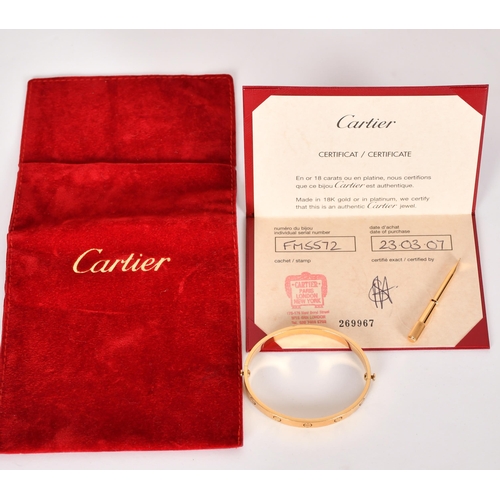 344 - Cartier Love bangle, designed as a manacle, signed, marks for 18ct, 39.7 grams. Complete with screwd... 