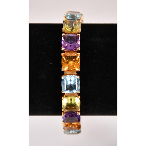 347 - An  Asprey 18ct gold multi gem set bracelet with citrine, topaz, peridot, and amethyst, marked ALDN,... 